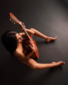 itaaya hasan holding guitar